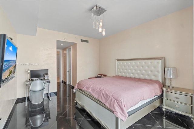 bedroom featuring dark tile patterned floors