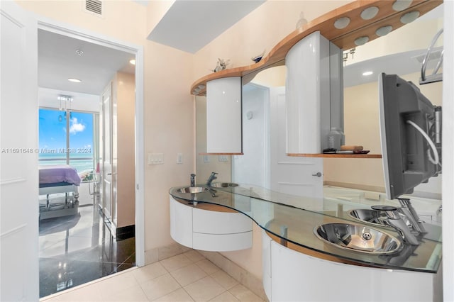 bathroom with tile patterned floors and vanity