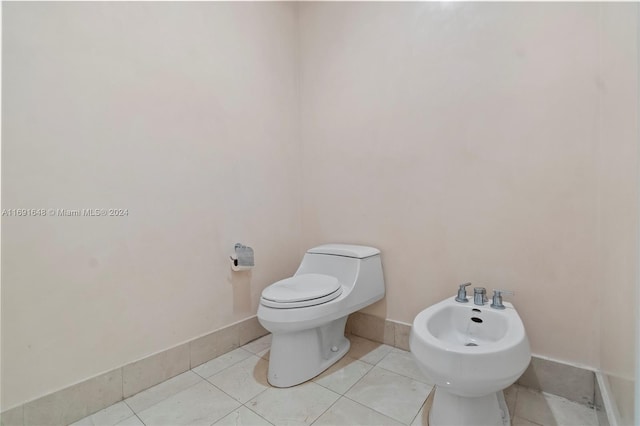 18101 Collins Ave Unit 1502, Sunny Isles Beach, FL 33160 - half bath featuring a bidet, toilet, tile patterned floors, and baseboards