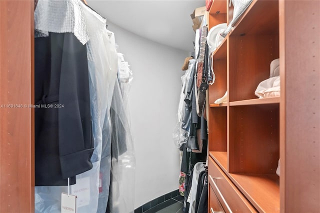 18101 Collins Ave Unit 1502, Sunny Isles Beach, FL 33160 - walk in closet with dark tile patterned floors