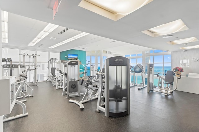 18101 Collins Ave Unit 1502, Sunny Isles Beach, FL 33160 - exercise room with a wall of windows and plenty of natural light