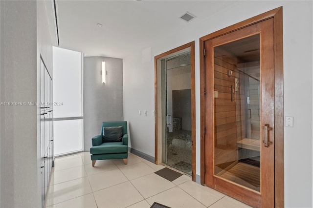 18101 Collins Ave Unit 1502, Sunny Isles Beach, FL 33160 - bathroom featuring a shower stall, a sauna, tile patterned flooring, and baseboards