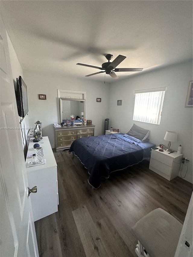 bedroom featuring dark hardwood / wood-style floors and ceiling fan