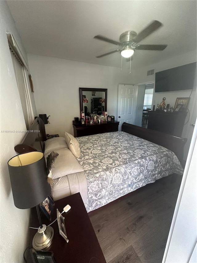 bedroom featuring hardwood / wood-style floors and ceiling fan