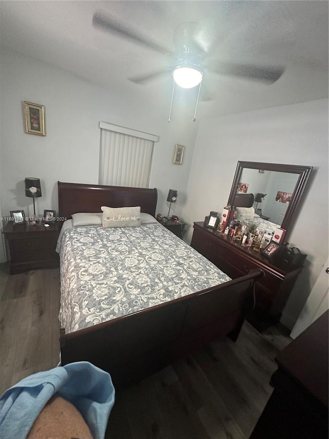 bedroom featuring hardwood / wood-style floors and ceiling fan