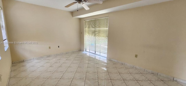 spare room with light tile patterned floors and ceiling fan