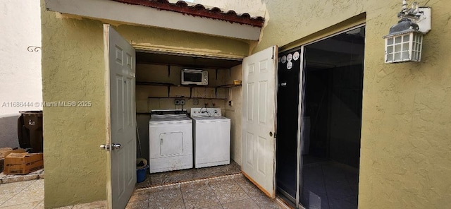 washroom with separate washer and dryer