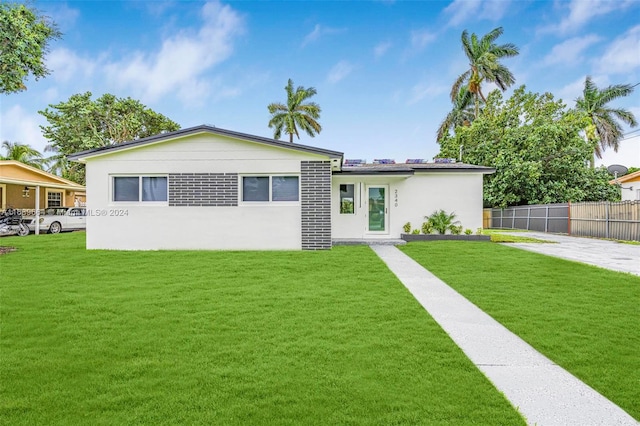 view of front of home featuring a front lawn