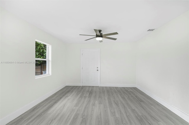 unfurnished room with ceiling fan and light hardwood / wood-style floors