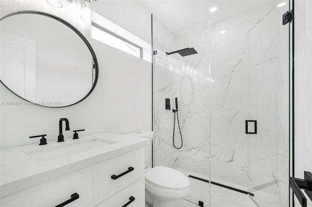 bathroom featuring toilet, vanity, and an enclosed shower