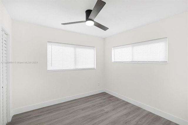 empty room featuring hardwood / wood-style floors and ceiling fan