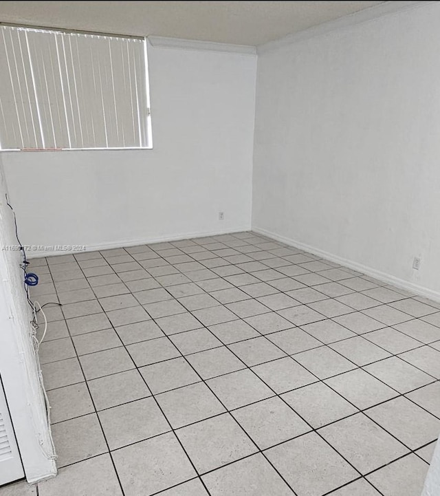 unfurnished room with light tile patterned floors