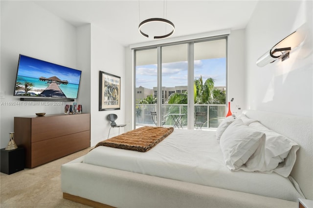 bedroom featuring a wall of windows and multiple windows