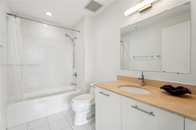 full bathroom featuring tile patterned flooring, vanity, toilet, and shower / bathtub combination with curtain