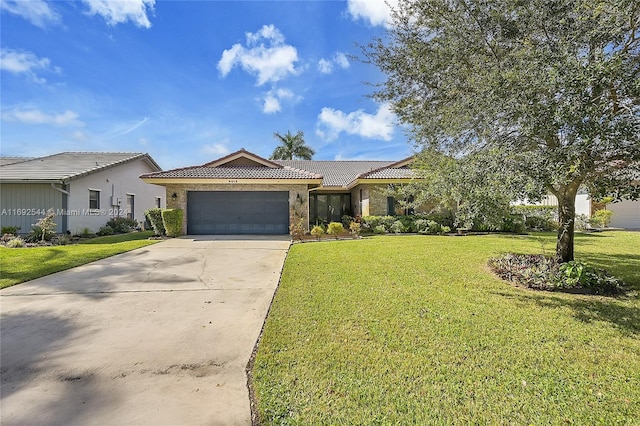 single story home featuring a garage and a front yard