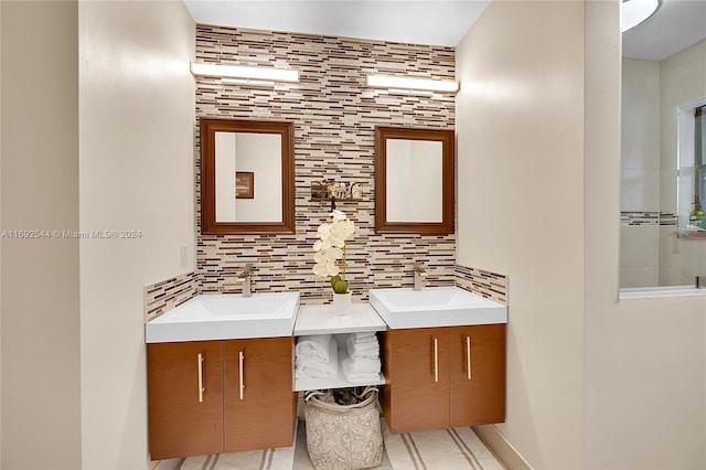 bathroom featuring vanity and backsplash