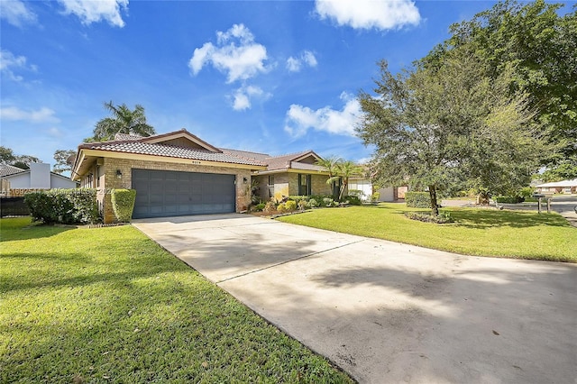 ranch-style home with a garage and a front yard