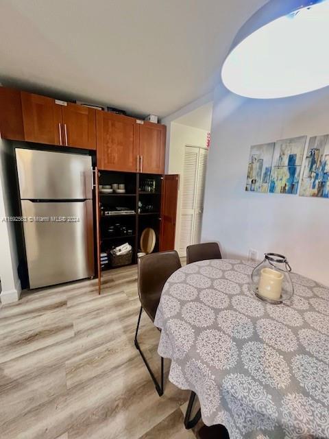 dining room with light hardwood / wood-style flooring