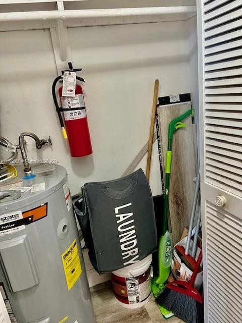 utility room featuring electric water heater