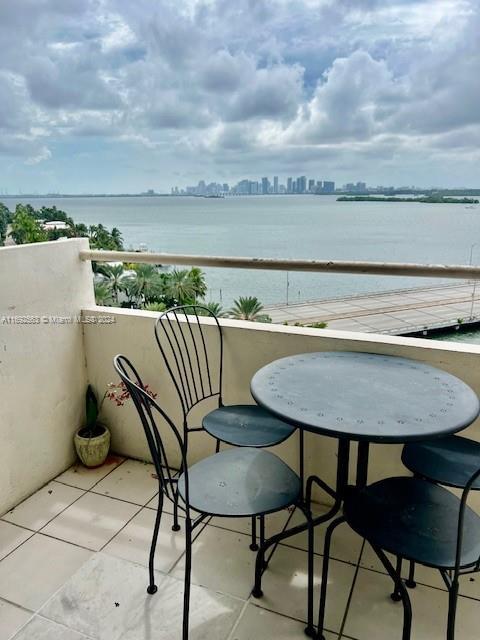 balcony featuring a water view