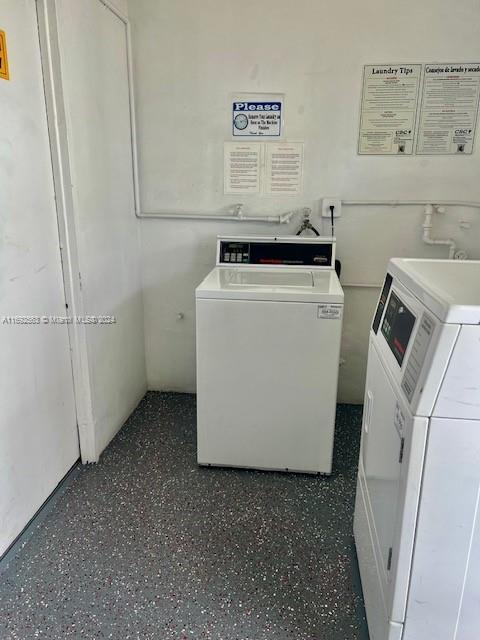 laundry area with independent washer and dryer