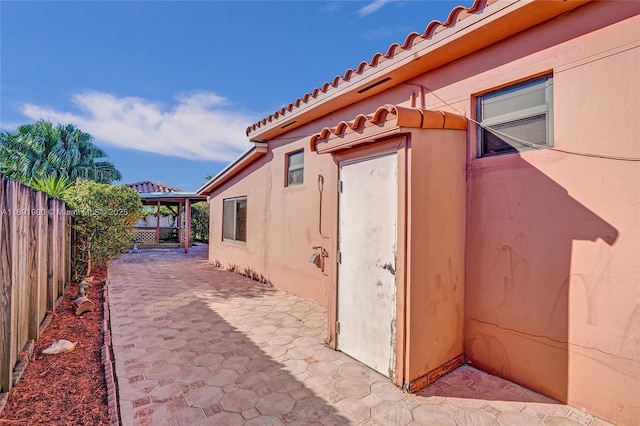 view of side of property with a patio