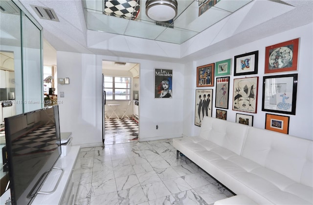 interior space with a textured ceiling