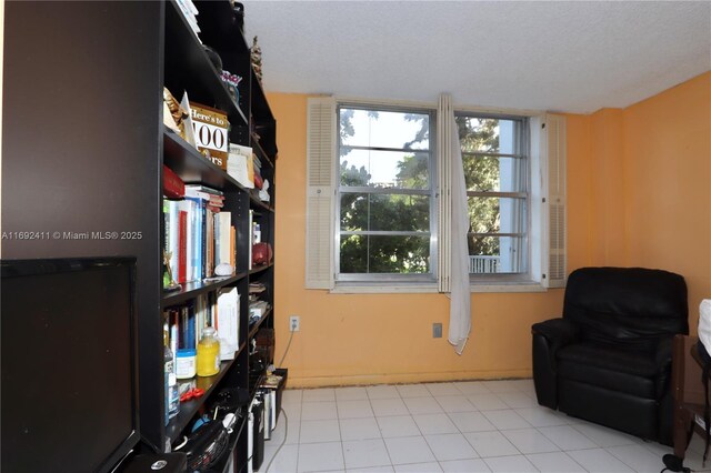 bedroom featuring light tile patterned floors