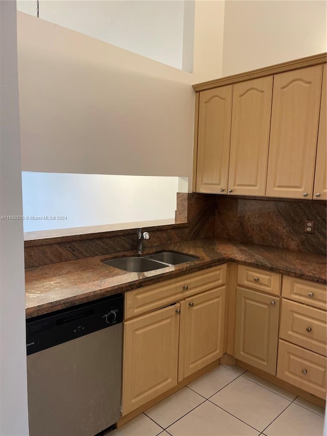 kitchen with dishwasher, backsplash, sink, light brown cabinetry, and light tile patterned flooring