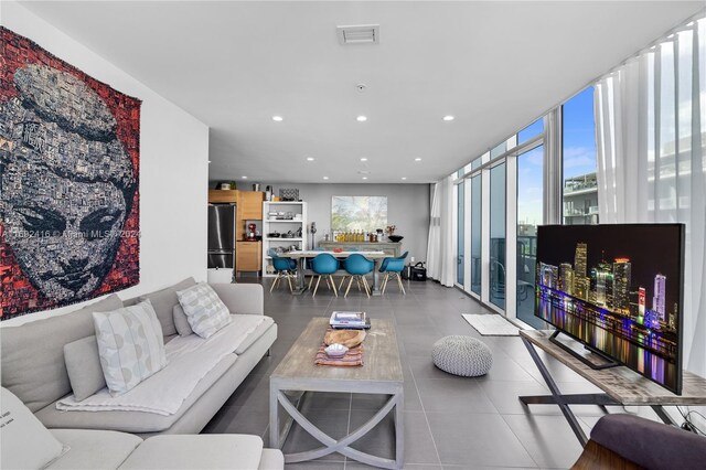 living room featuring a wall of windows