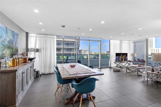 dining area featuring a wall of windows