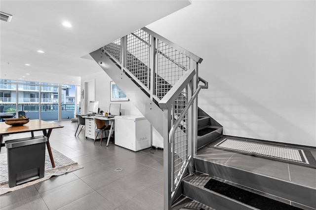 stairs with floor to ceiling windows