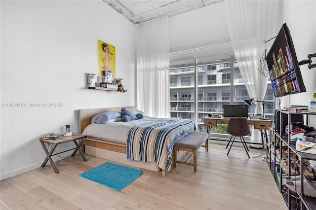 bedroom with wood-type flooring