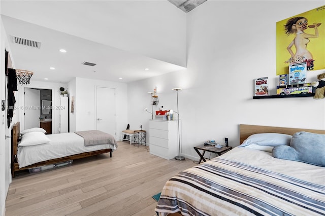 bedroom with light hardwood / wood-style flooring