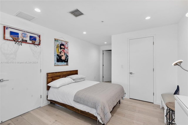 bedroom with light hardwood / wood-style flooring