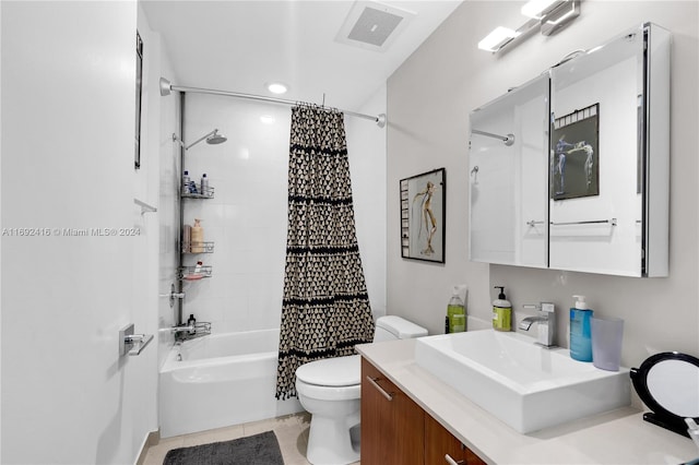 full bathroom featuring tile patterned flooring, vanity, toilet, and shower / bathtub combination with curtain