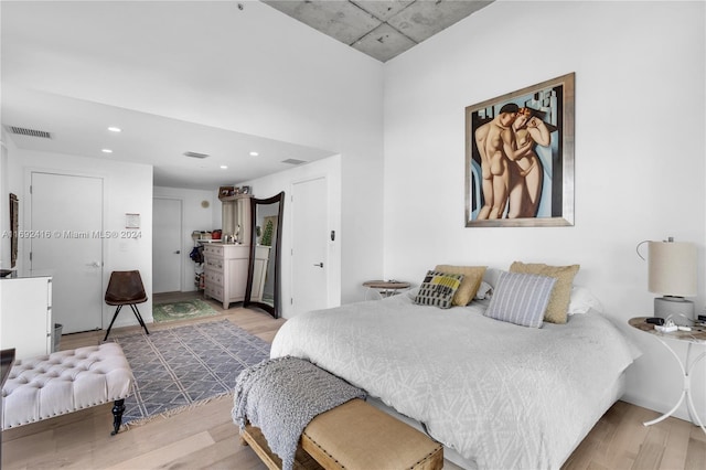 bedroom with light hardwood / wood-style flooring