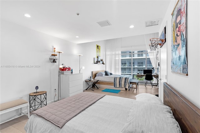 bedroom with light hardwood / wood-style flooring