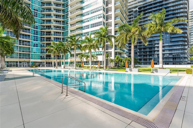 view of swimming pool with a patio area