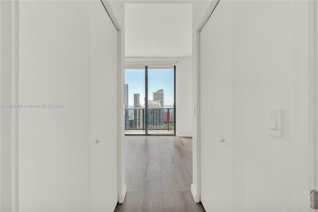 45 SW 9th St Unit 4306, Miami, FL 33130 - hall featuring wood finished floors, baseboards, and a view of city