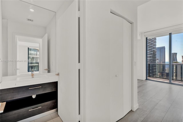 45 SW 9th St Unit 4306, Miami, FL 33130 - bathroom with plenty of natural light, vanity, a city view, and baseboards