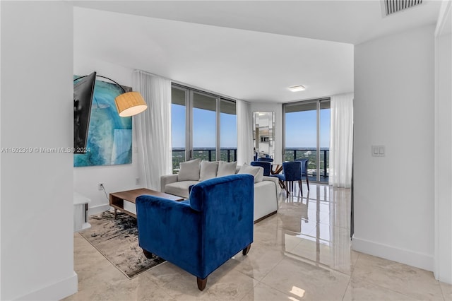 living room with a wall of windows