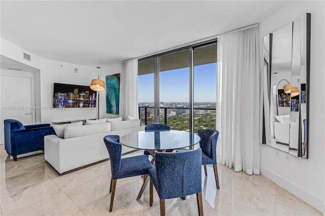 dining space featuring expansive windows