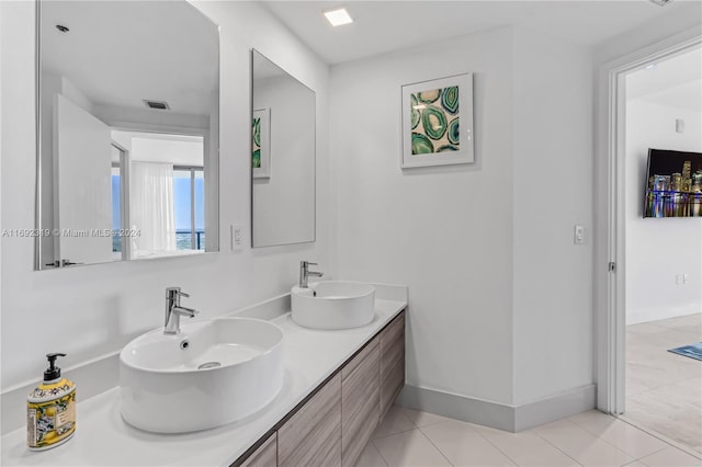 bathroom with vanity and tile patterned flooring