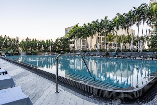 view of pool at dusk