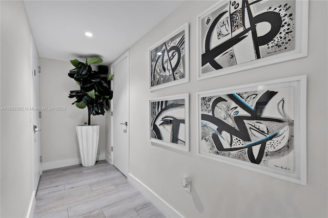 121 NE 34th St Unit Ph3217, Miami, FL 33137 - hallway with baseboards, recessed lighting, and light wood finished floors