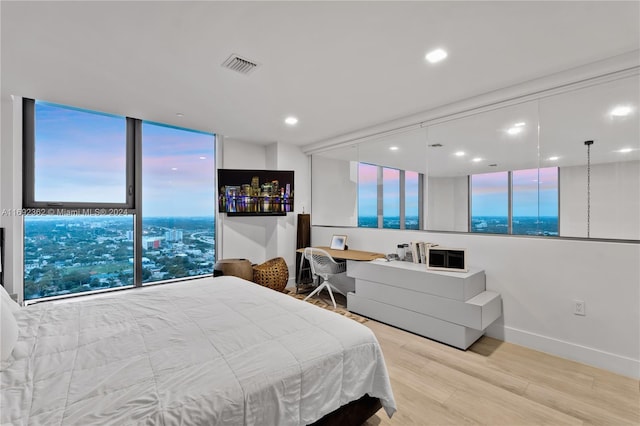 bedroom featuring light hardwood / wood-style floors