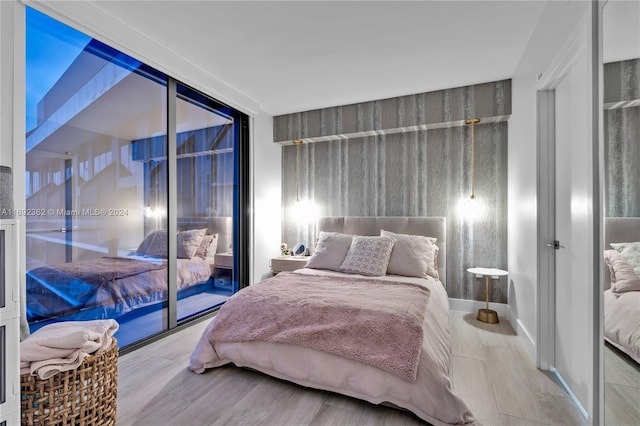 bedroom with light wood-type flooring