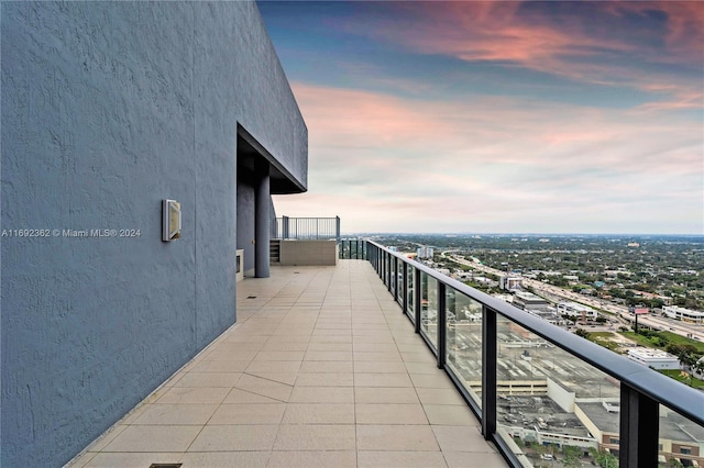 view of balcony at dusk