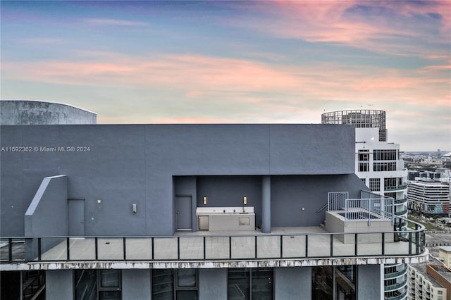 view of outdoor building at dusk